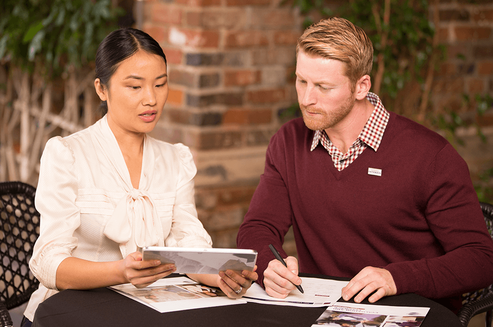 Woman and man talking at table