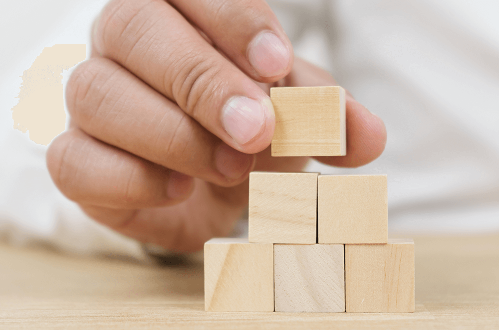 Hand stacking little blocks