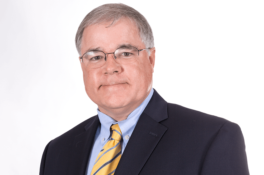 Man in suit with yellow tie