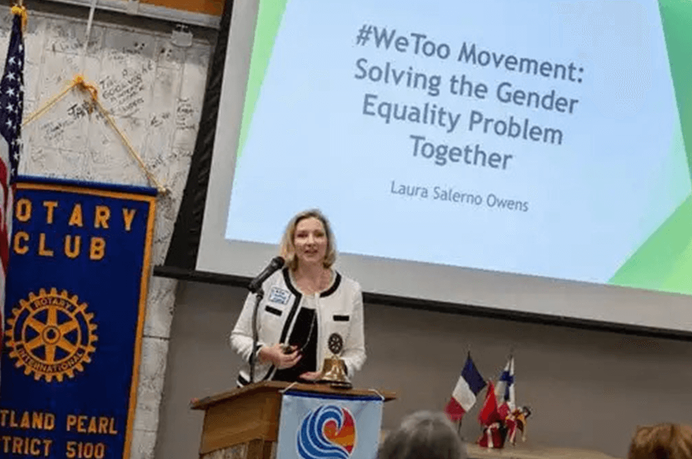 Woman speaking at lectern onstage